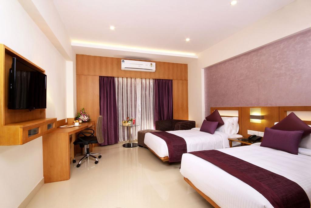 Hotel Chrysoberyl Kottayam Quarto foto