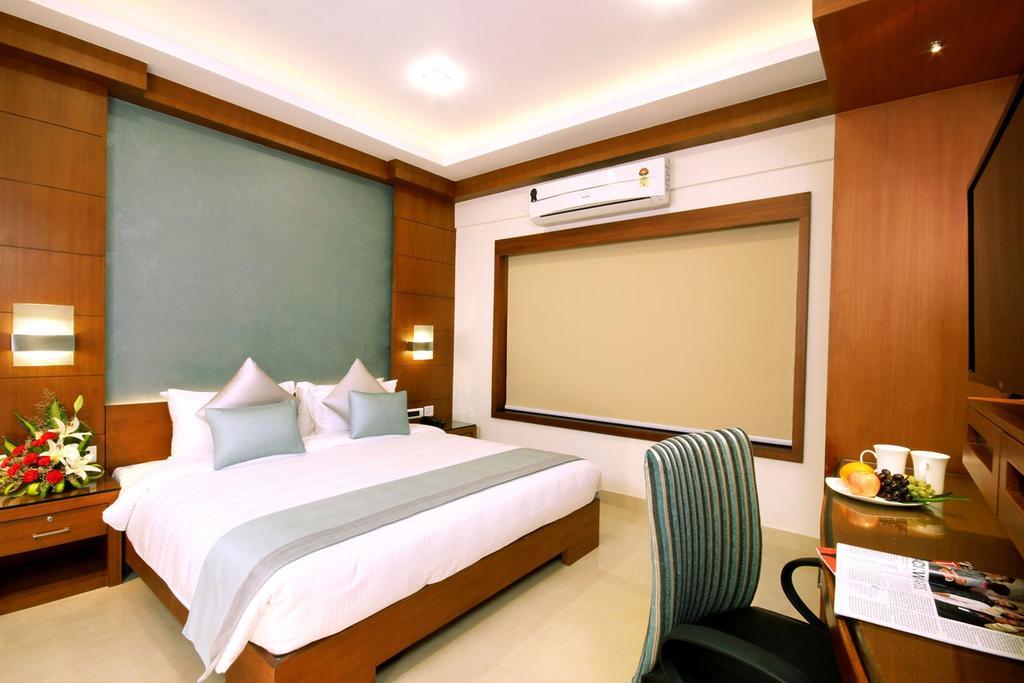 Hotel Chrysoberyl Kottayam Quarto foto