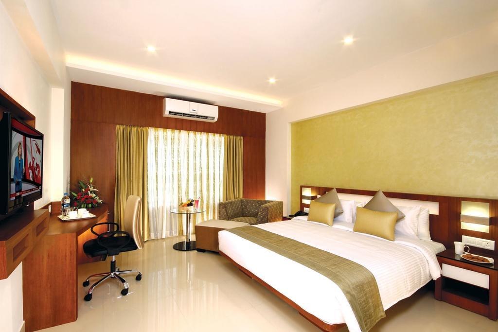 Hotel Chrysoberyl Kottayam Quarto foto